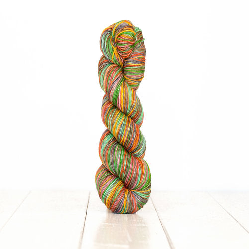 Color 3013: a hand-dyed self-striping wool yarn with green, red, yellow, and brown shades