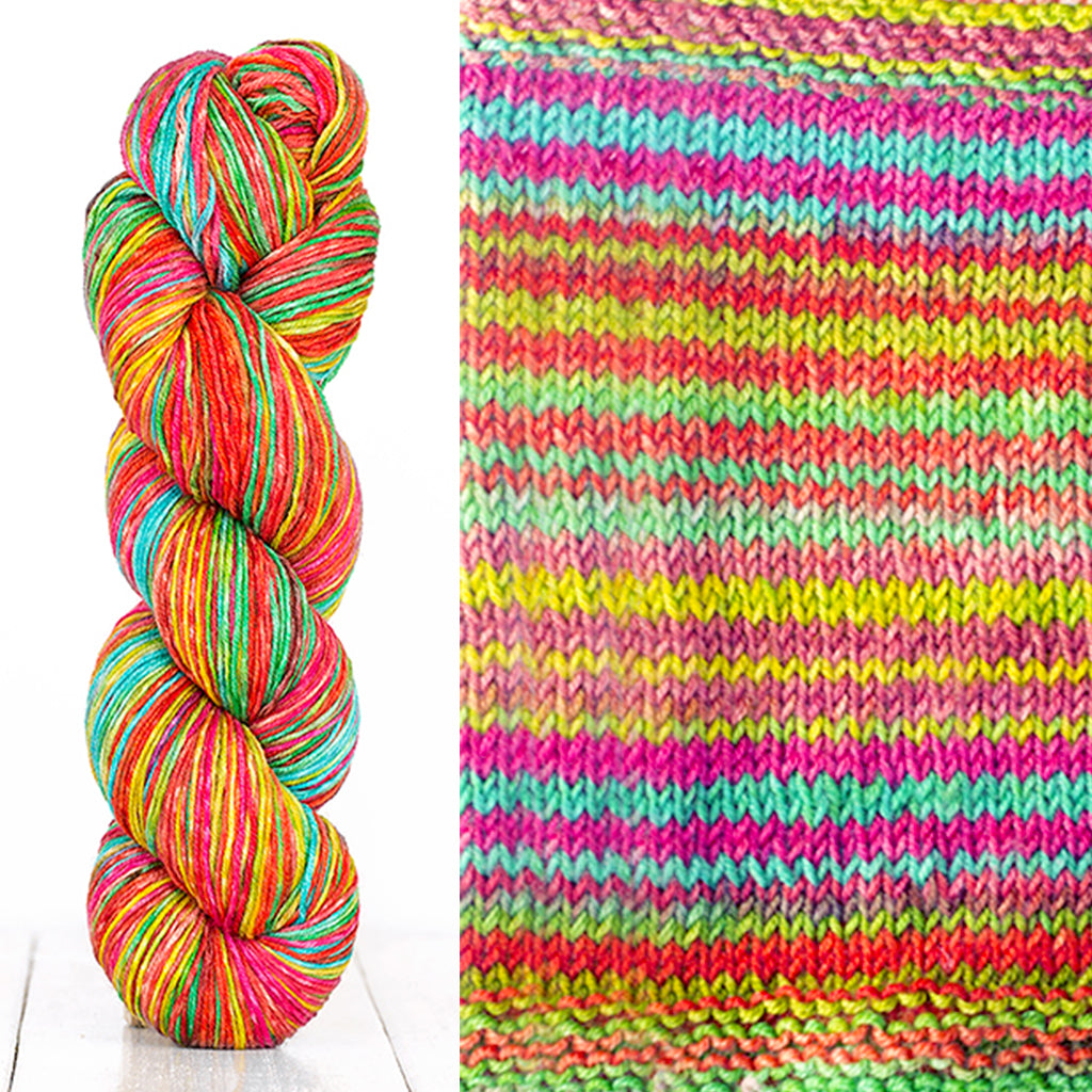Color 3014: a hand-dyed skein of self striping wool yarn with pink, blue, green, and yellow shades