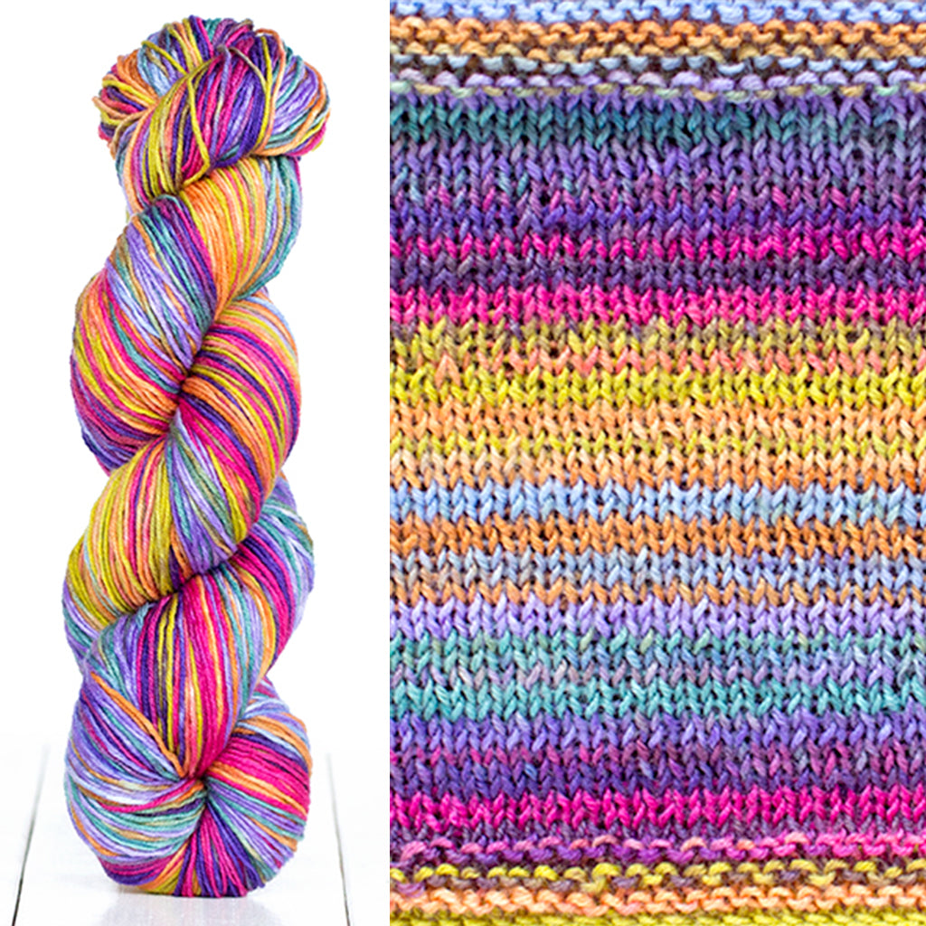Color 3024: a hand-dyed skein of self striping wool yarn with blue, yellow, pink, and purple shades