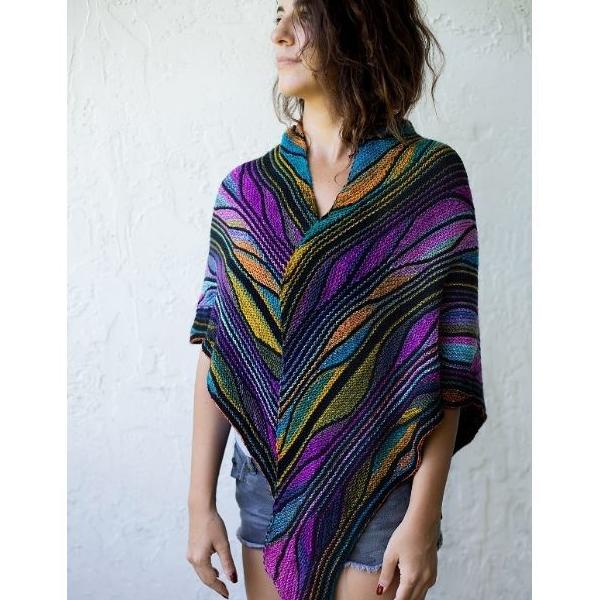 Model wearing the Butterfly Papillon Shawl Pattern in the shades purple, green, and blue.