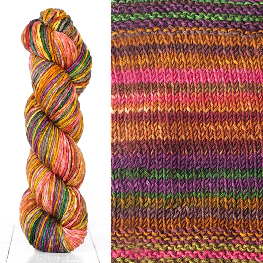 Color 4008: a hand-dyed skein of self striping wool yarn with brown, pink, orange, and purple shades