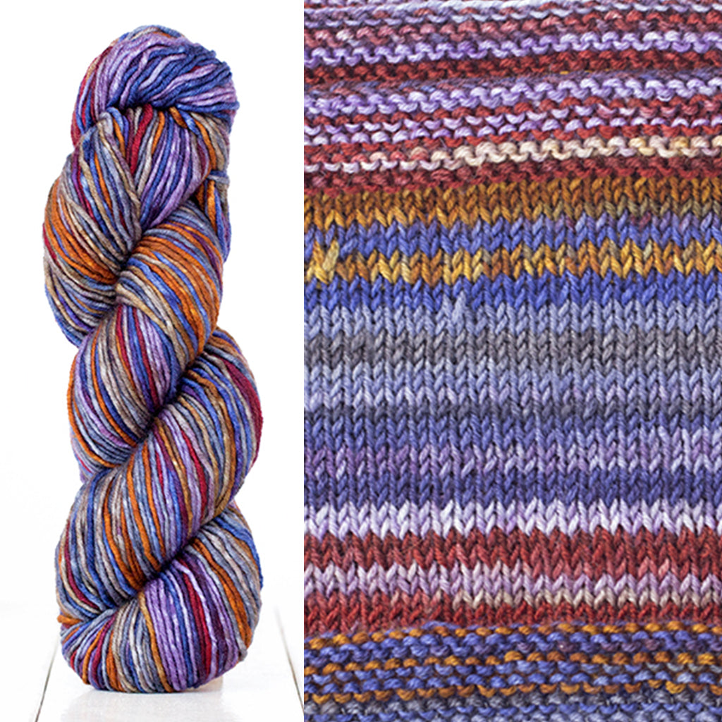 Color 4017: a hand-dyed skein of self striping wool yarn with purple, grey, brown, and blue shades