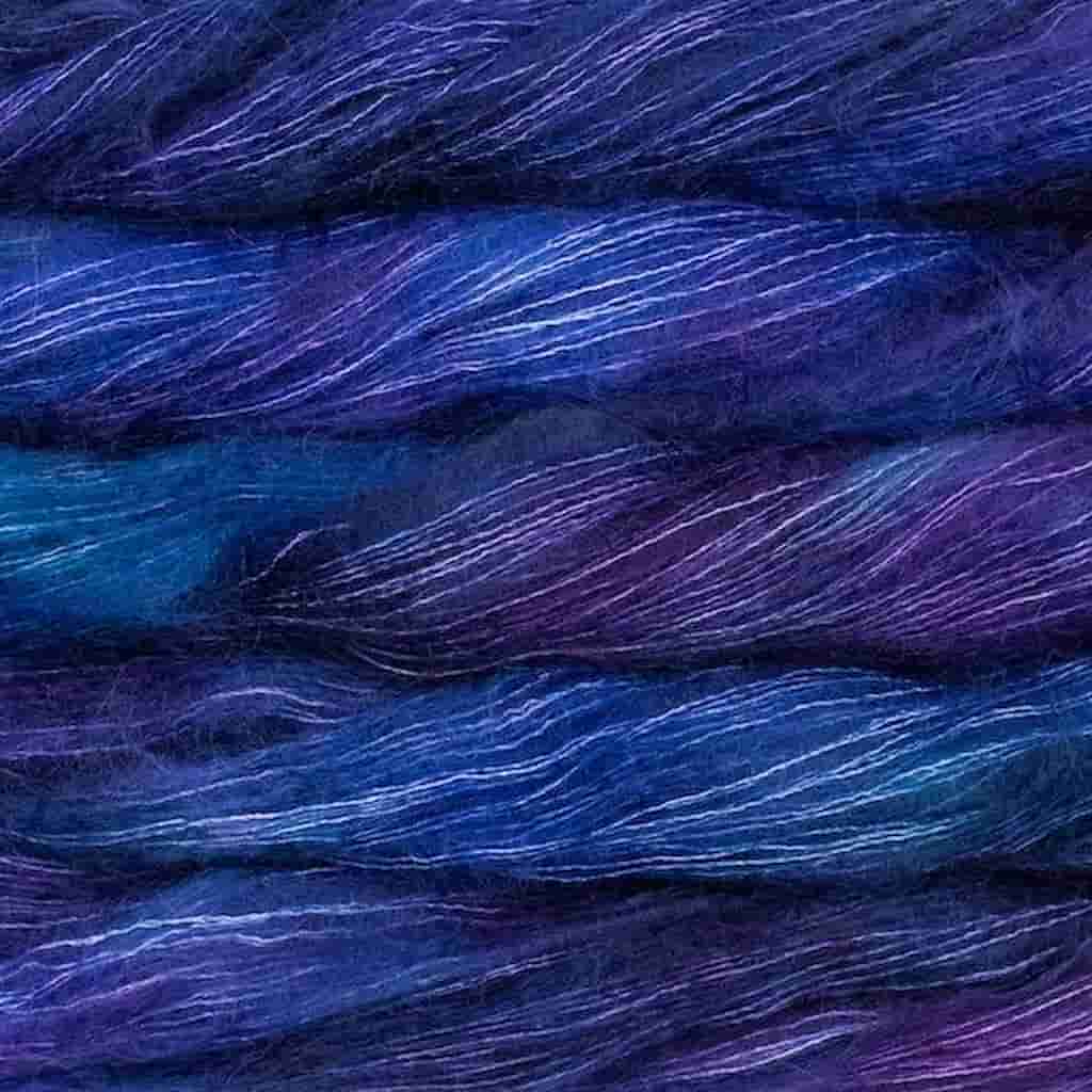 Color: Whales Roade 247.  A bright blue and purple variegated color of Malabrigo Mohair yarn. 
