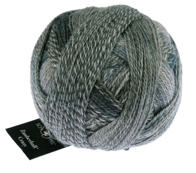 Color 2428 Mud Pack. A neutral greyish green multicolored ball of yarn