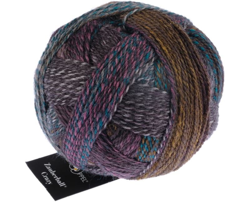 Color 2475 Background Noise. A mauve, brown, and dark teal ball of multicolored yarn