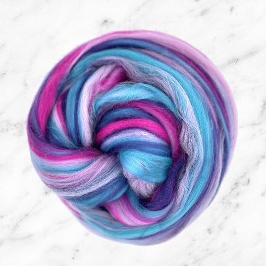 Color Bubblegum Surprise. A blend of merino top in blue, pink, and purple shades.