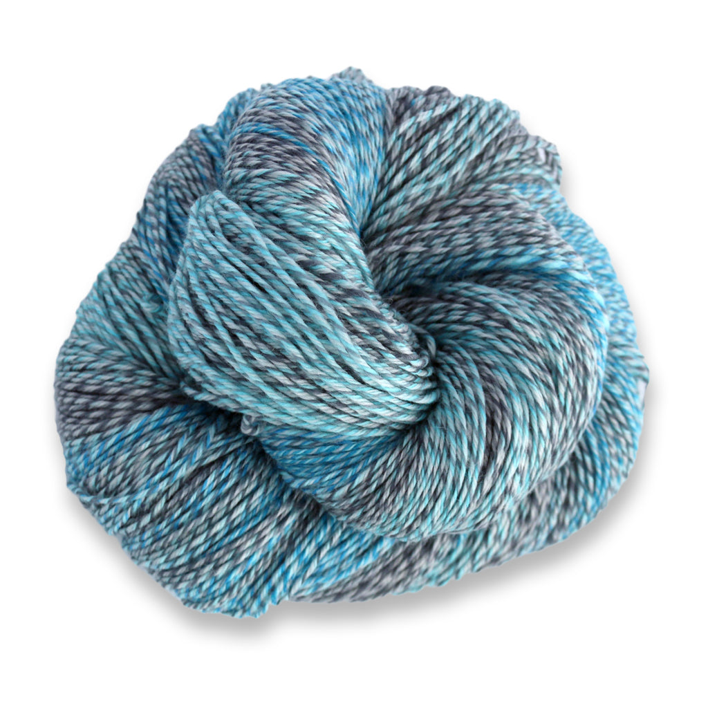 Heritage Wave in the color Plume 501, a marled light blue and grey sock yarn with long color changes