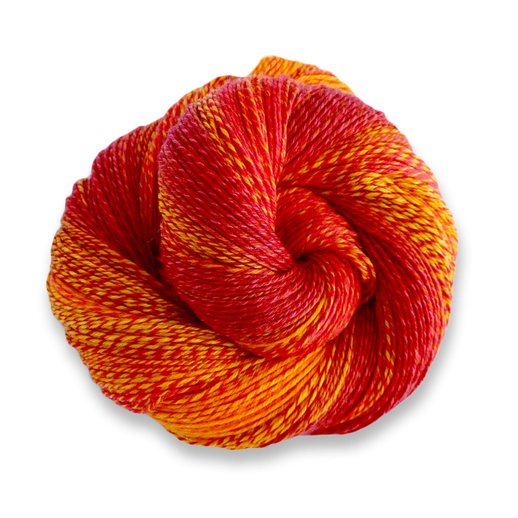 Heritage Wave in the color Solar 502, a marled fiery yellow, orange, and red sock yarn.
