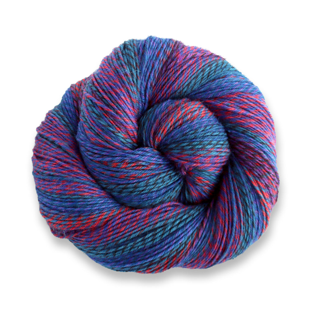 Heritage Wave in the color Stained Glass 509, a marled red, coral blue, and purple sock yarn