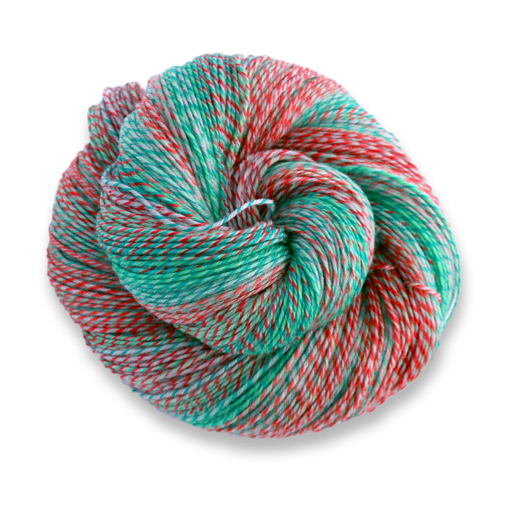 Heritage Wave in the color Holidaze 513, a marled green, red, and grey sock yarn