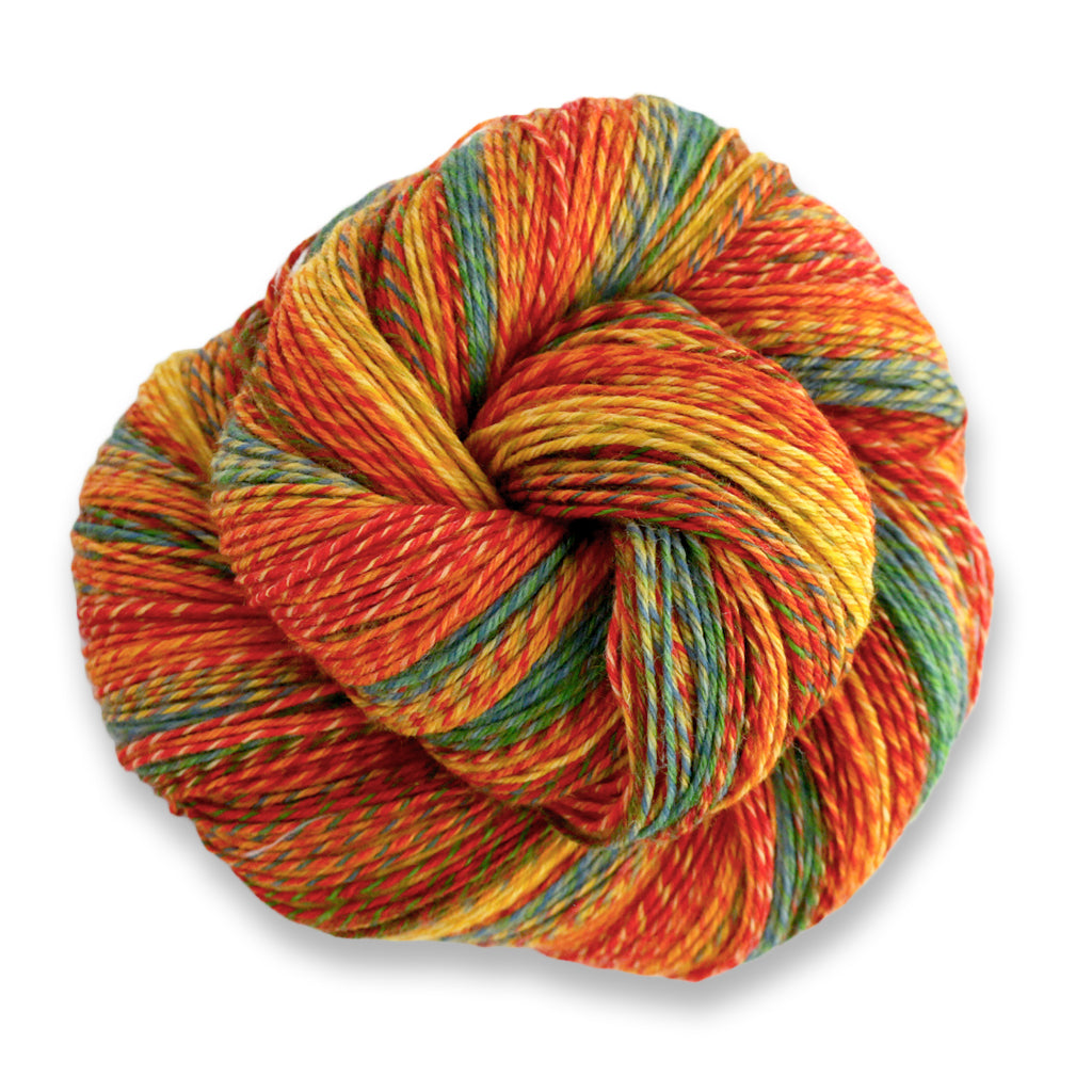 Heritage Wave in the color Rainbow 517, a marled autumnal red, orange, yellow, blue, & green yarn