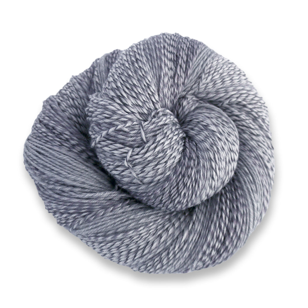 Heritage Wave in the color Graphite 515, a marled grey sock yarn with long color changes