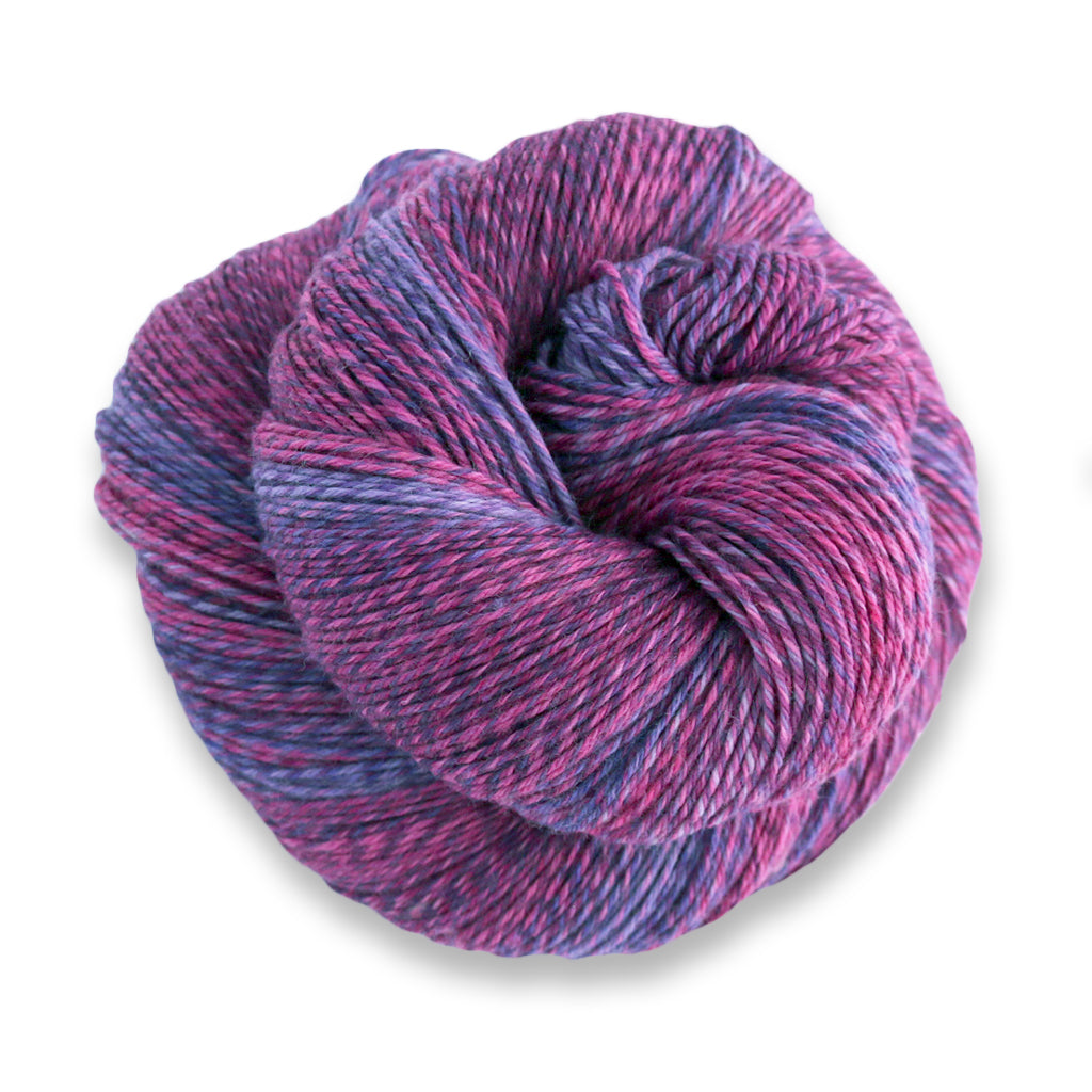 Heritage Wave in the color Grapes 518, a marled purple and pink sock yarn with long color changes