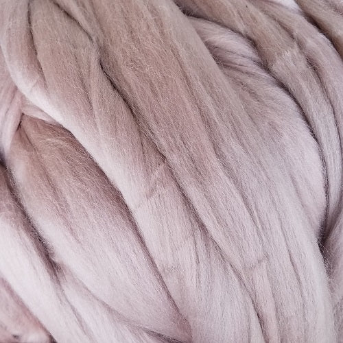 Color Cabbage Rose. A light pink shade of solid color merino wool top.