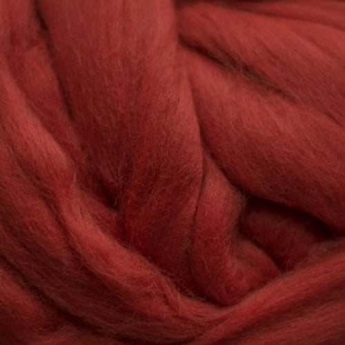 Color Cinnabar. A medium red orange shade of solid color merino wool top.