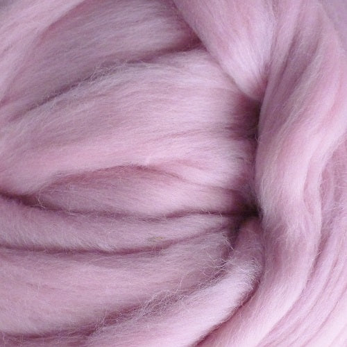 Color Dusty Rose. A light pink shade of solid color merino wool top.