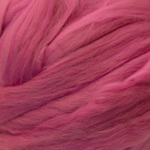 Color Fuchsia. A medium pink shade of solid color merino wool top.
