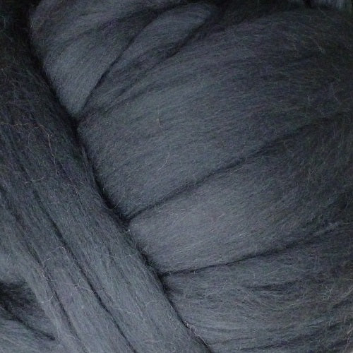 Color Graphite. A medium dark grey shade of solid color merino wool top.