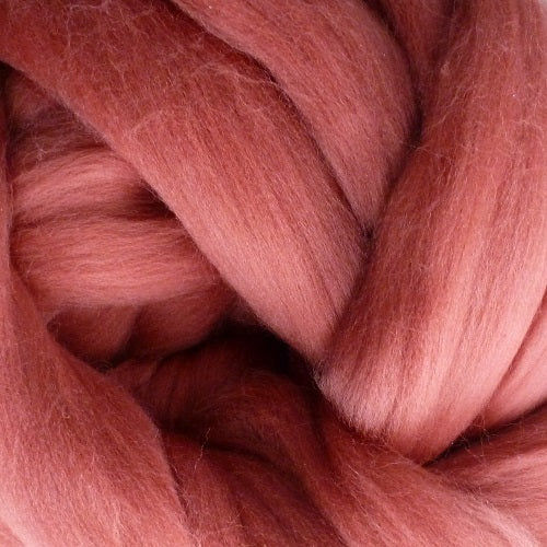 Color Mulberry. A medium pink shade of solid color merino wool top.