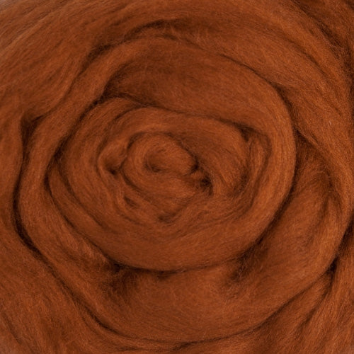Color Nutmeg. A medium dark orange shade of solid color merino wool top.