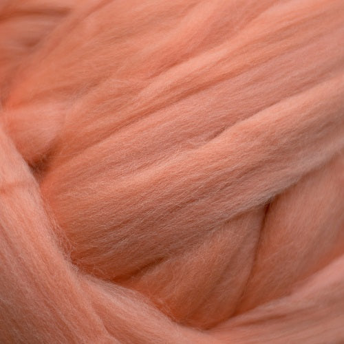 Color Salmon. A medium light pink orange shade of solid color merino wool top.