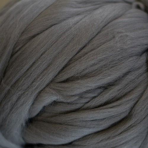 Color Silver. A medium dark grey shade of solid color merino wool top.