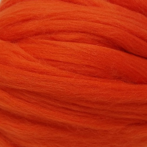Color Spice. A bright orange red shade of solid color merino wool top.