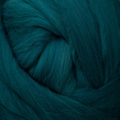 Color Teal. A medium dark blue green shade of solid color merino wool top.