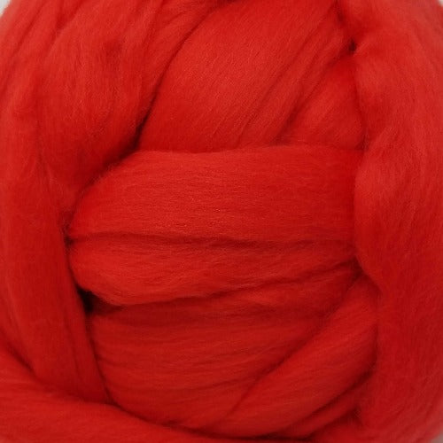 Color Tomato. A bright red shade of solid color merino wool top.