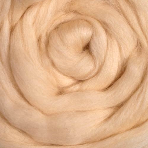 Color Vanilla. A light cream shade of solid color merino wool top.