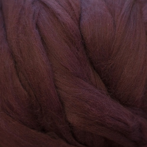 Color Wine. A dark red purple shade of solid color merino wool top.