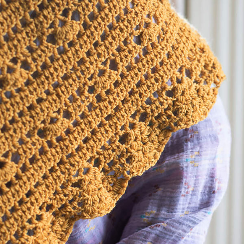 A close up of the stitch detail on the crochet Cressida Shawl.