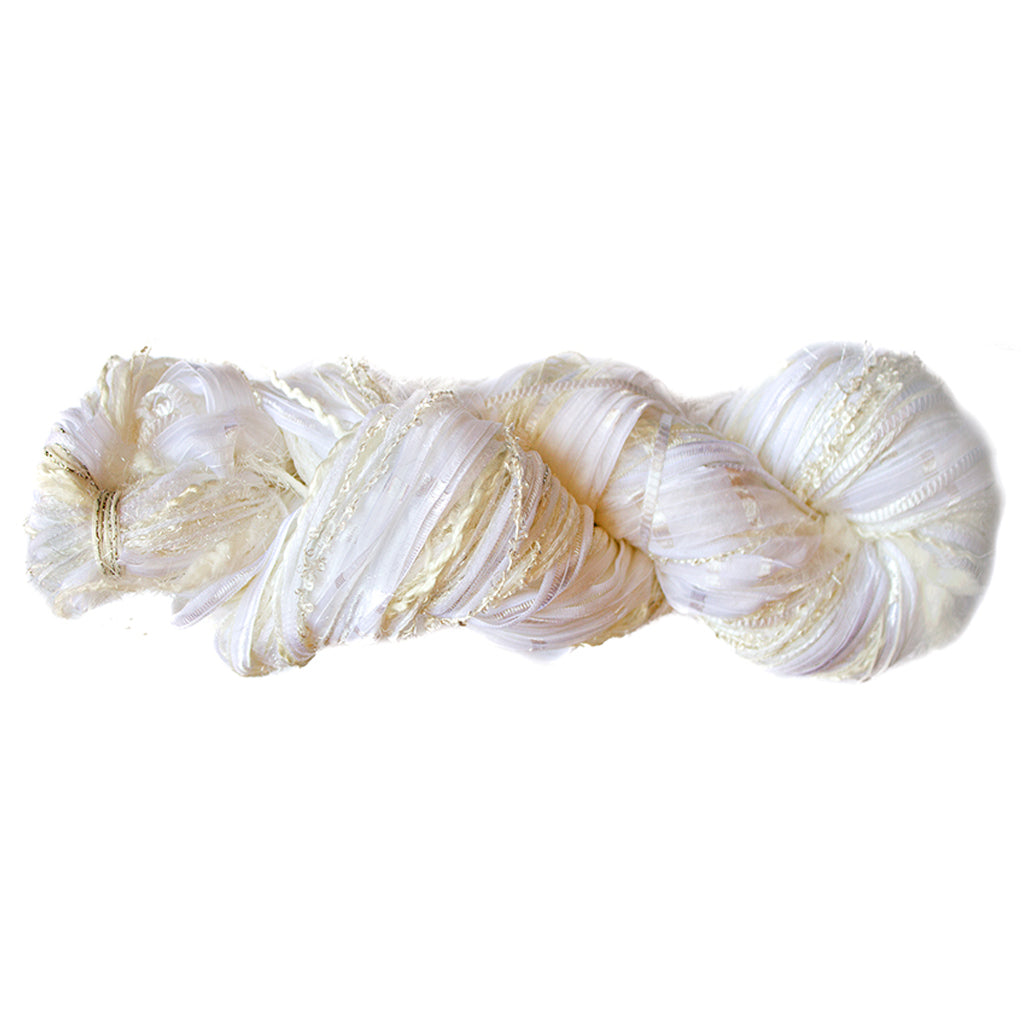 Color 501, a skein of white yarn, full of texture and sparkle.