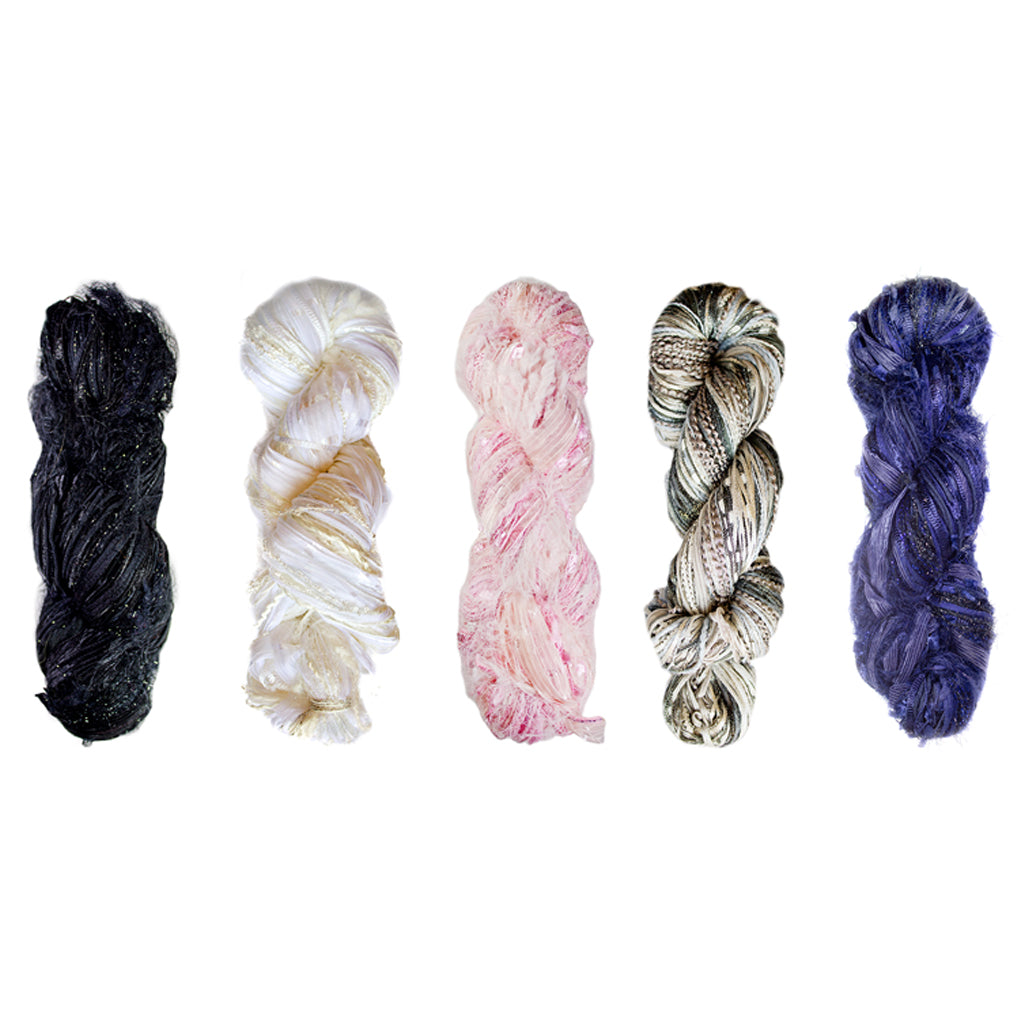 5 sparkling skeins of Alp Dazzle in the colors 500, 501, 502, 514, and 522.