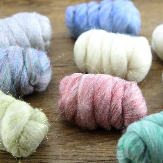 A close up look at bundles of glitter merino fiber. Assorted colors. 