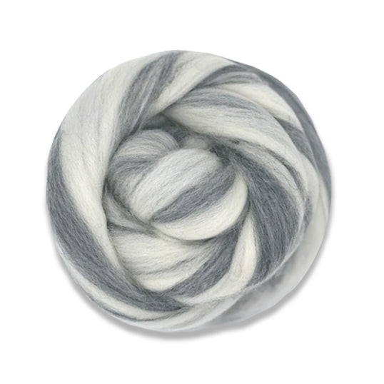 A ball of tonal humbug merino wool top in the shades natural and grey.