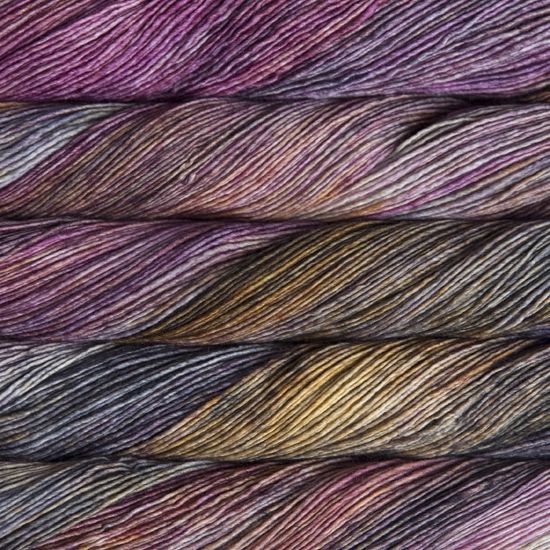Malabrigo Mechita Illusion Yarn- a variegated pink, purple, yellow and black colorway