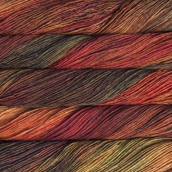 Malabrigo Mechita Volcan Yarn- a variegated red, orange, yellow and green colorway