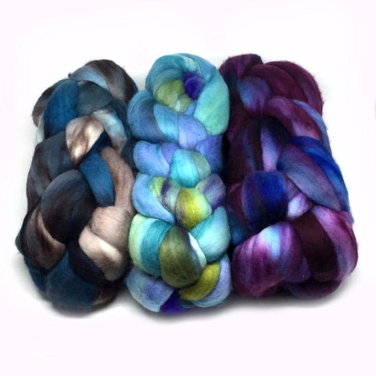 Three hand dyed malabrigo nube merino wool top fiber braids.