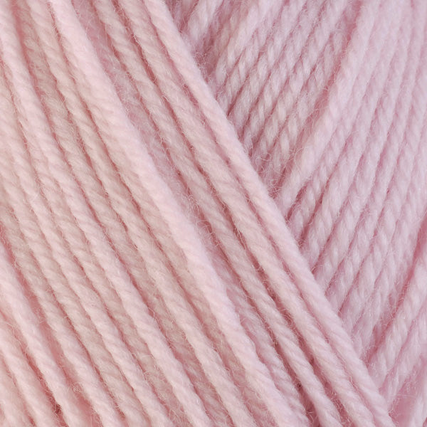 Alyssum 3310, a pale pink skein of washable worsted weight Ultra Wool yarn.