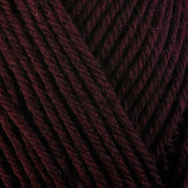 Beet Root 33151, a dark burgundy red skein of washable worsted weight Ultra Wool yarn.