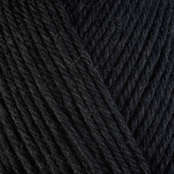 Black Pepper 33113, a heathered black skein of washable worsted weight Ultra Wool yarn.