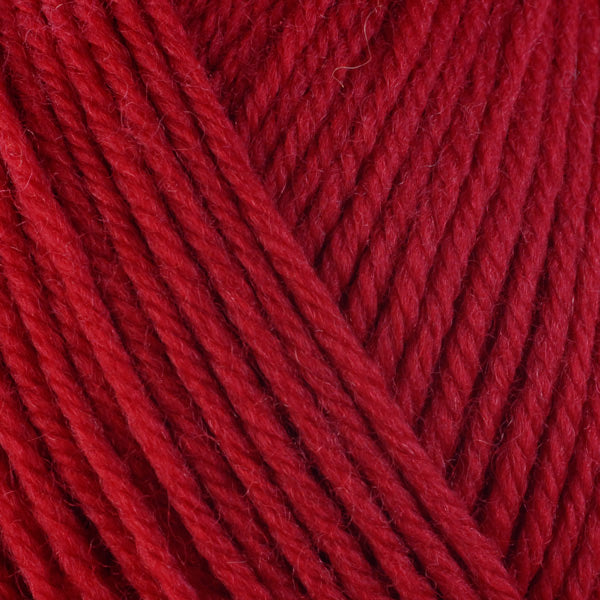 Chili 3350, a bright fiery red skein of washable worsted weight Ultra Wool yarn.