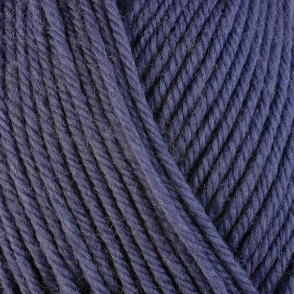 Columbine 3320, a dusty purple-blue skein of washable worsted weight Ultra Wool yarn.