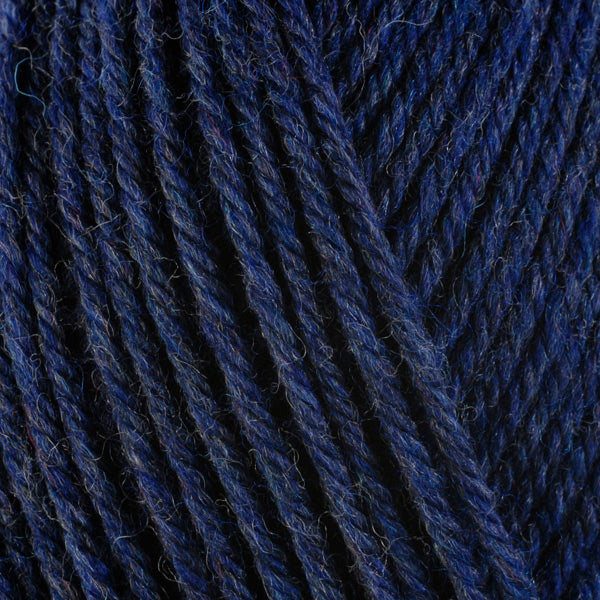 Denim 33154, a dark heathered blue skein of washable worsted weight Ultra Wool yarn.