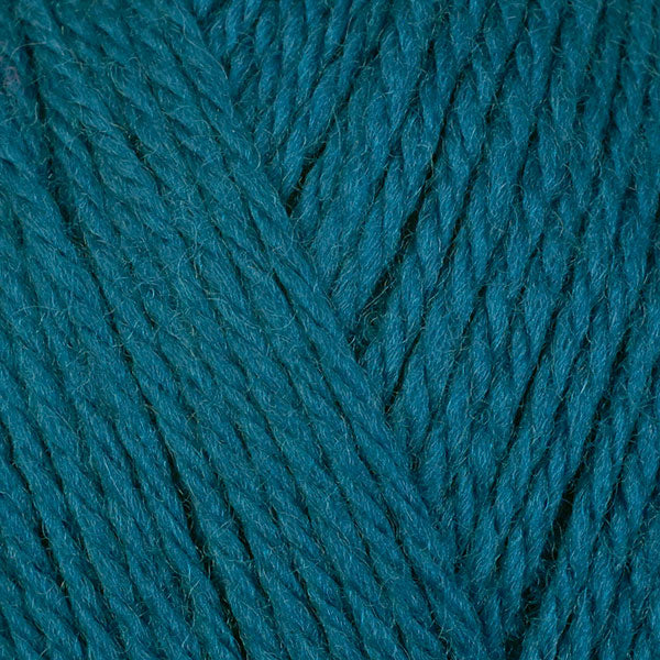 Kale 8341, a dark turquoise blue skein of washable DK weight Ultra Wool yarn.