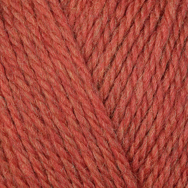 Sunflower 83122, a slightly heathered red-orange skein of washable DK weight Ultra Wool yarn.