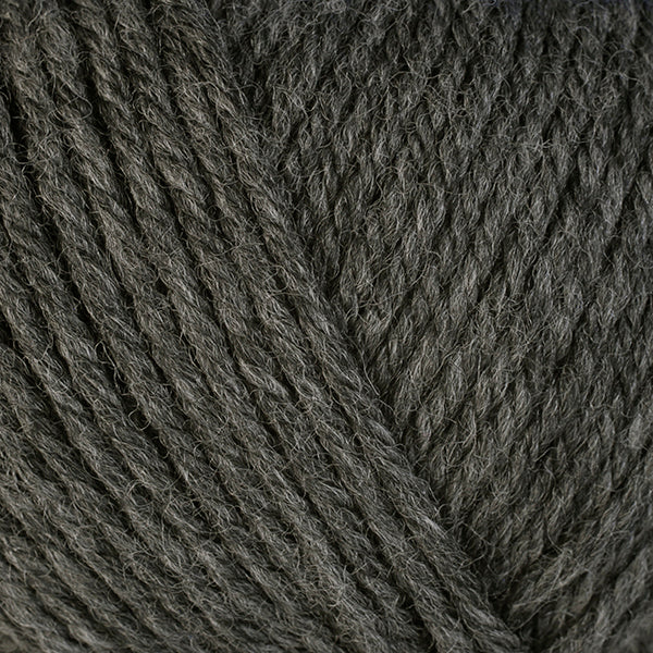 Granite 33107, a medium heathered grey skein of washable worsted weight Ultra Wool yarn.
