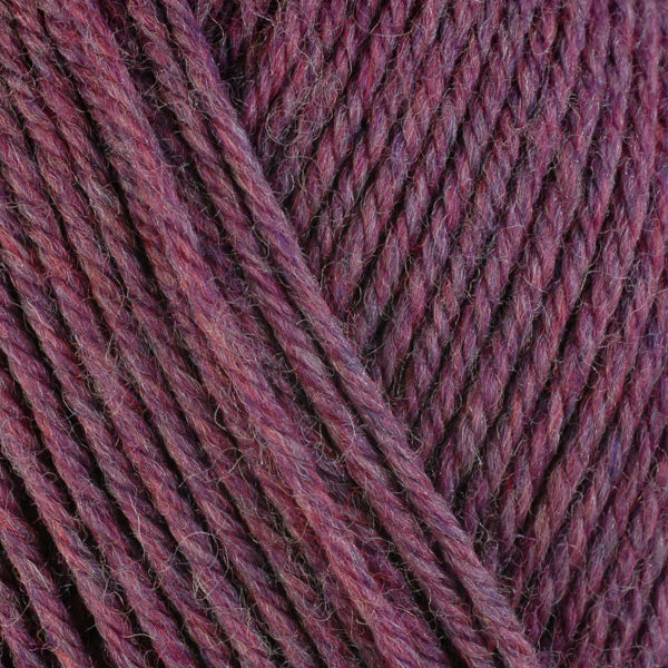 Heather 33153, a heathered pink skein of washable worsted weight Ultra Wool yarn.