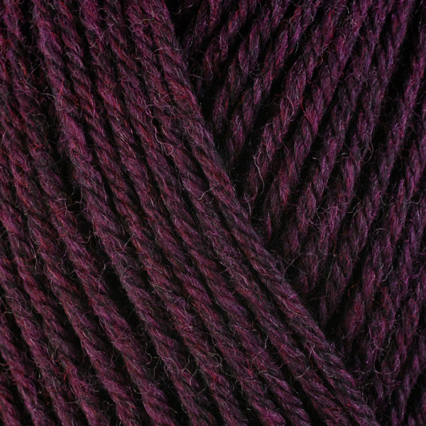 Hollyhock 33159, a dark heathered burgundy-purple skein of washable worsted weight Ultra Wool yarn.
